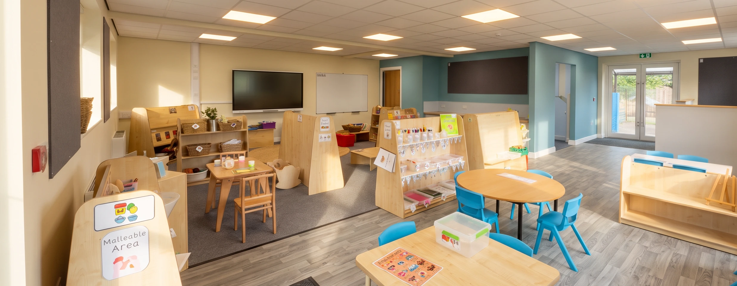The new reception classroom at Ackworth Mill Dam School, set out with child-sized tables, chairs and play areas