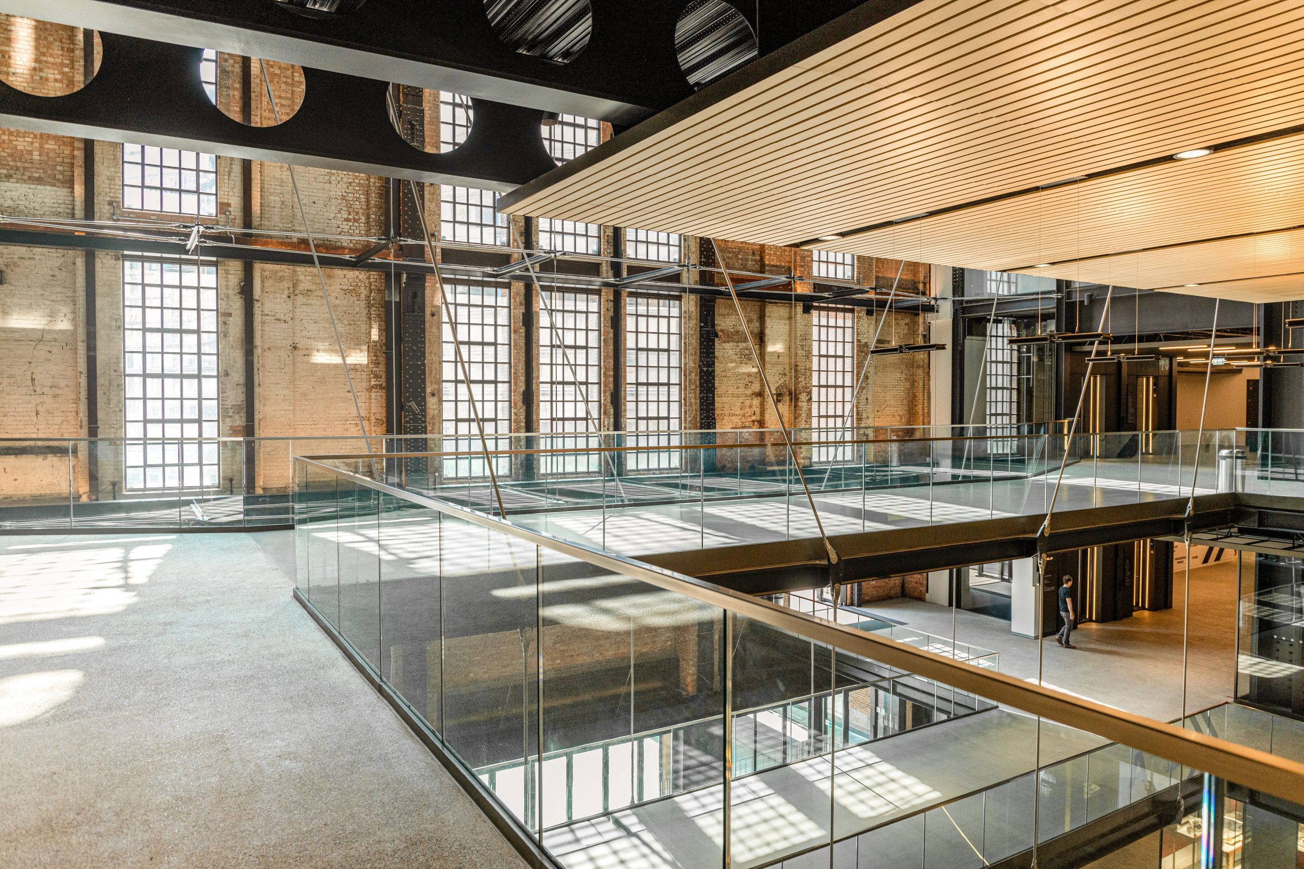 Glazed walkways and roof lights inside a converted industrial building